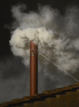 White smoke rises from the chimney on the Sistine Chapel indicating that a new pope has been elected at the Vatican